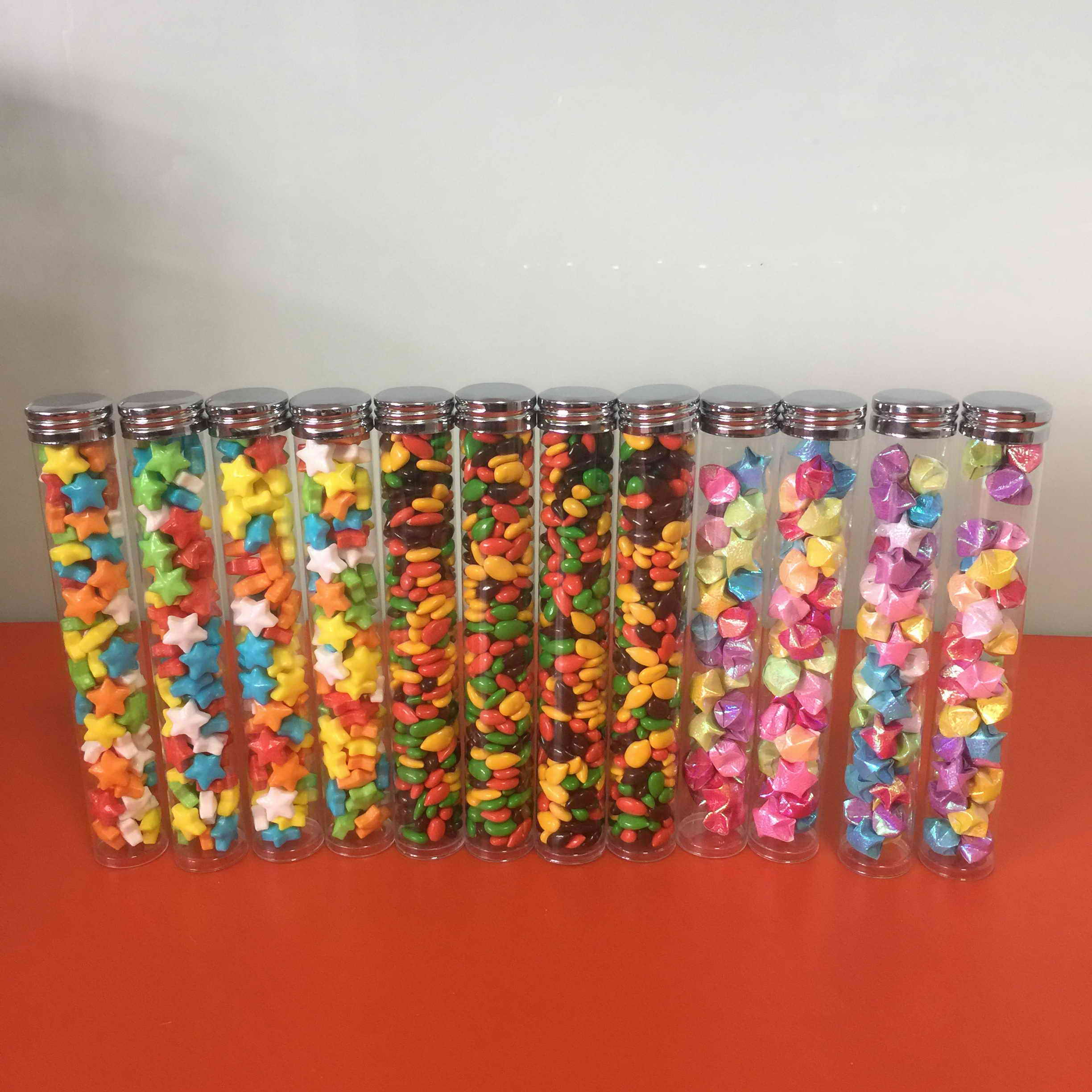 clear candt tubes,lindts lindor candy tubs,clear tube with screw caps.clear tube with tinplate